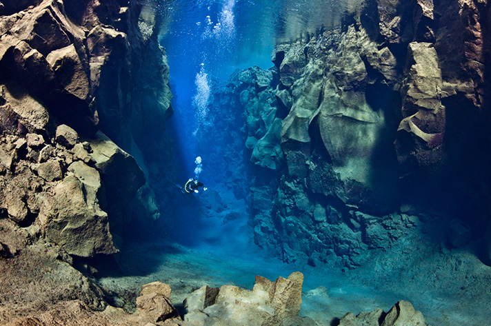 Incredible places to dive around the world: Exploring the tectonic plates in Silfra, Þingvellir. Photo by Explore More