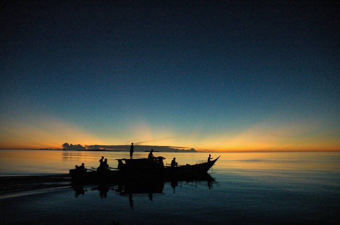 An equatorial sunset as seen from Rani Island in Irian Jaya. Photo by ♪ ~, Flickr