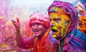 Tourists and locals celebrate Holi together. Photo by Jitendra Singh Flickr