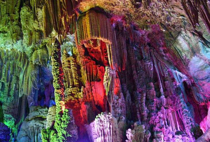 The Reed Flute Cave in China contains incredible stone pillars and rock formations. Photo by topAdvisor