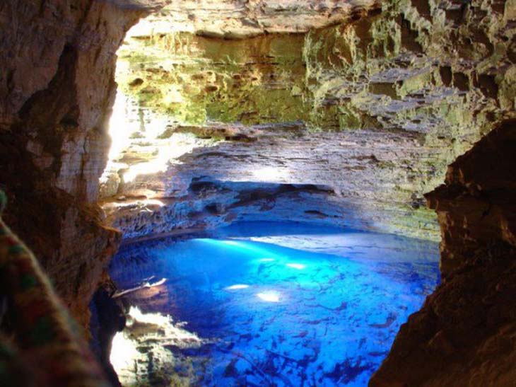 The Enchanted Well, the water is so blue as sunlight reacts with minerals in the water. Photo by topDreamer